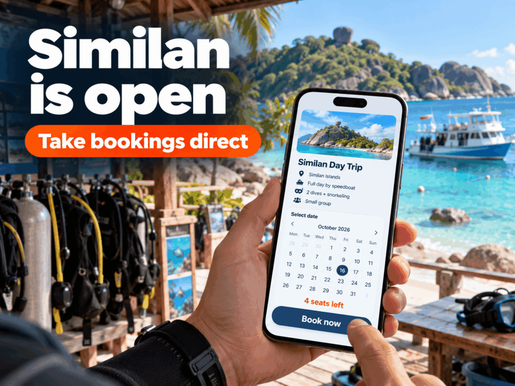 Dive shop owner in Khao Lak taking an online booking for a Similan dive trip
